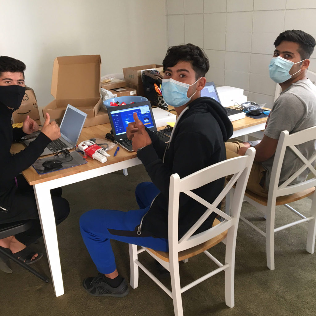 refugees with computers